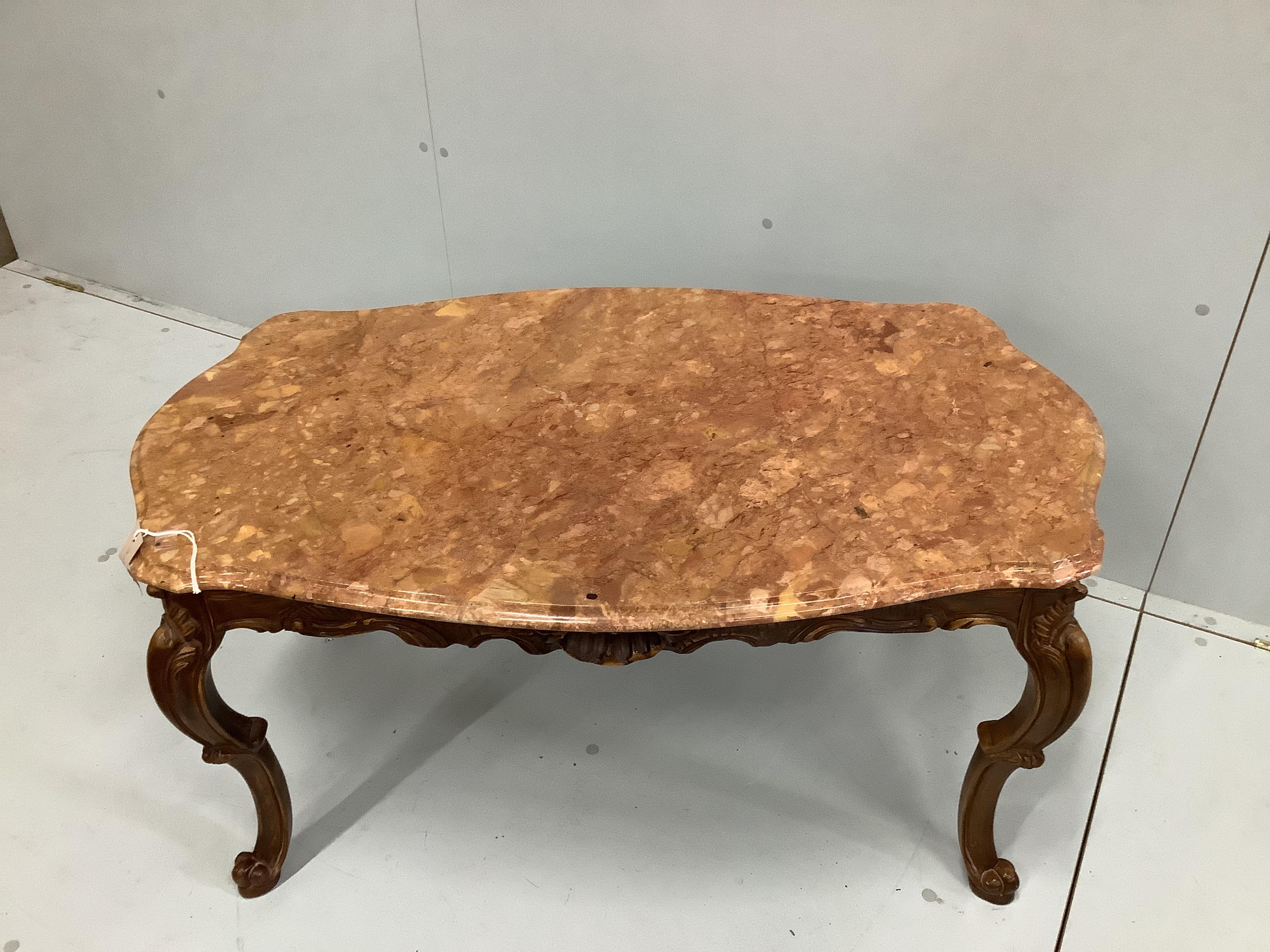 A rectangular coffee table, with shaped and moulded 'Rosso Verona' marble top, on carved cabriole legs, width 100cm, depth 60cm, height 49cm
